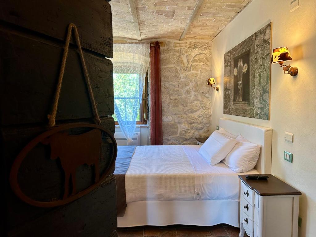 Postel nebo postele na pokoji v ubytování La quercia B&B
