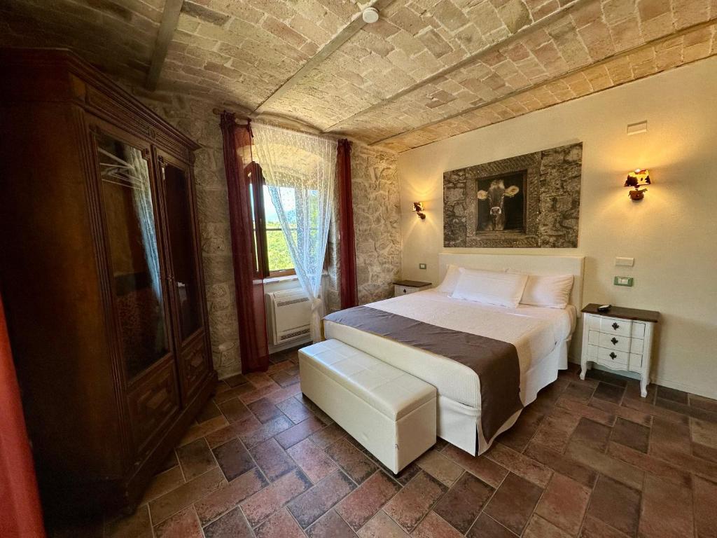 Postel nebo postele na pokoji v ubytování La quercia B&B