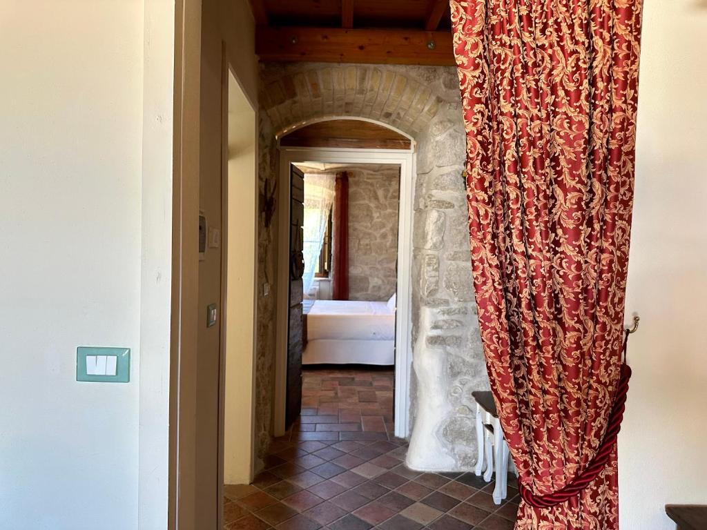 Postel nebo postele na pokoji v ubytování La quercia B&B