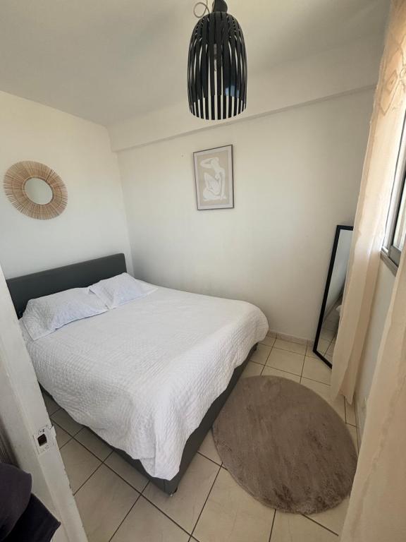 Postel nebo postele na pokoji v ubytování T2 Vue mer en plein cœur de Palavas Tout équipé