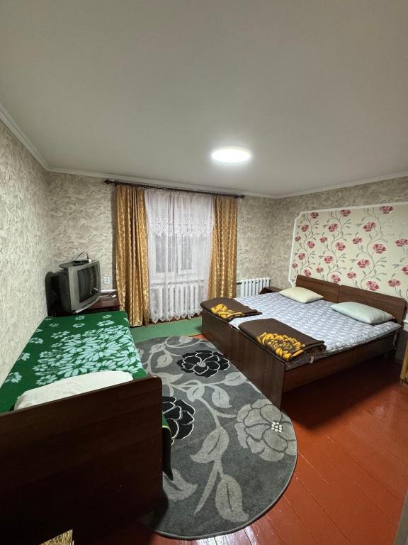 Postel nebo postele na pokoji v ubytování Helena guest house