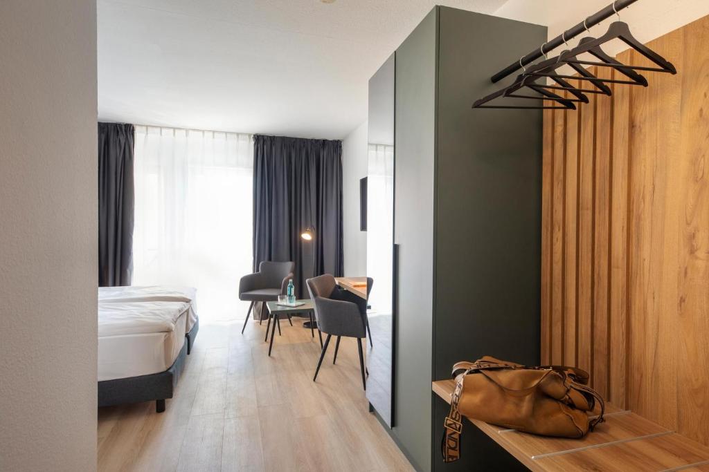 Posezení v ubytování ACHAT Hotel Schwetzingen Heidelberg