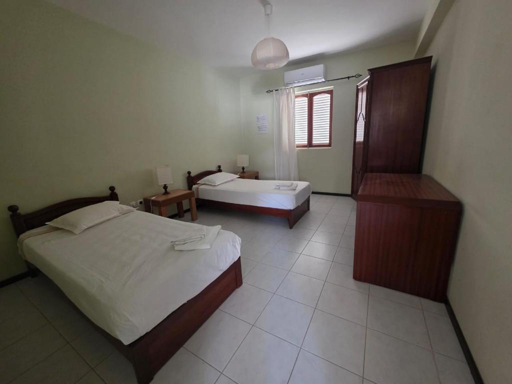 Postel nebo postele na pokoji v ubytování Residencial Raiar