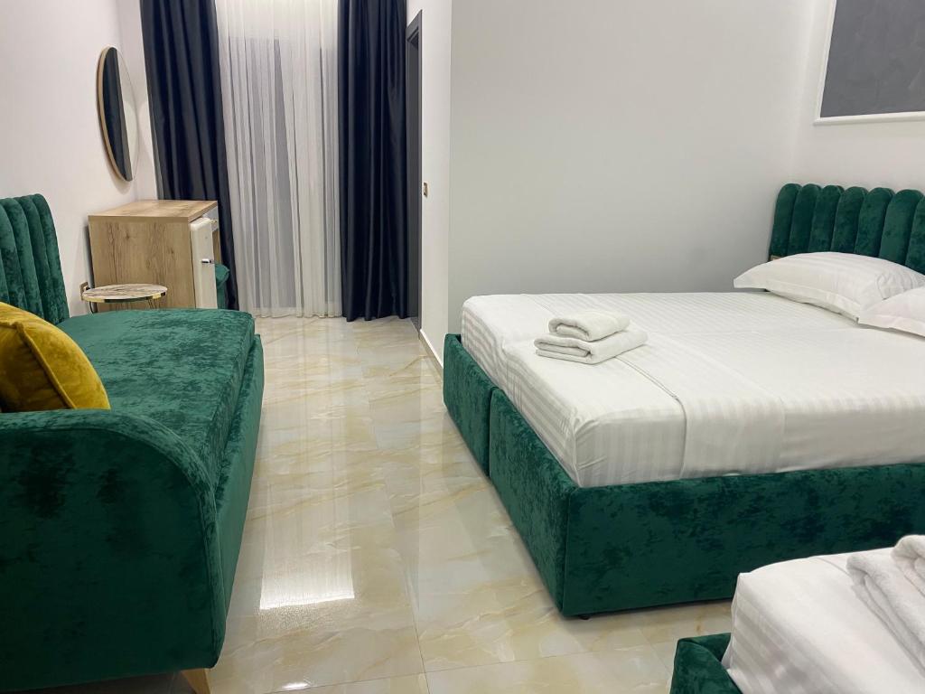 Postel nebo postele na pokoji v ubytování Hotel Leodori 1
