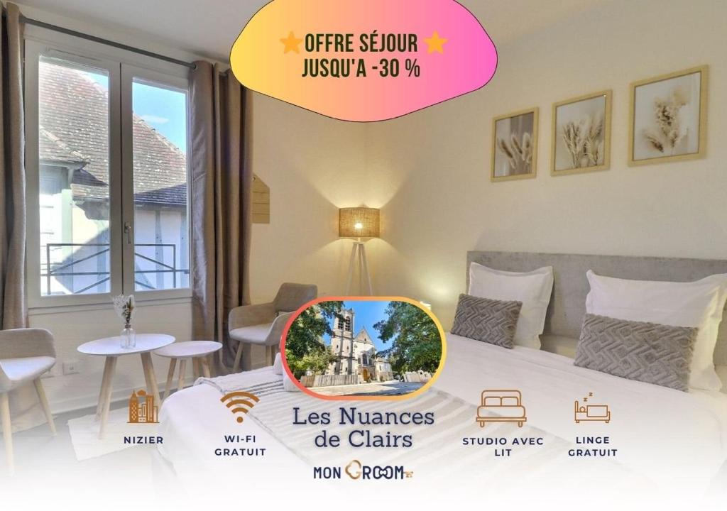 une chambre avec un lit avec un panneau indiquant que les chats meurent dans l'établissement Aux nuances de clairs - Studio cosy dans quartier historique cathédrale - Mon Groom, à Troyes