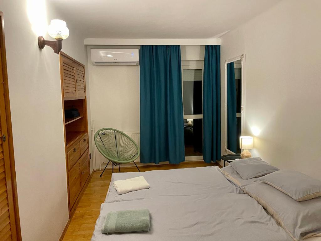 Posteľ alebo postele v izbe v ubytovaní Veranda Apartman