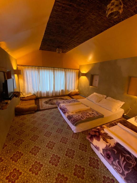 Postel nebo postele na pokoji v ubytování Safari Resort Skardu