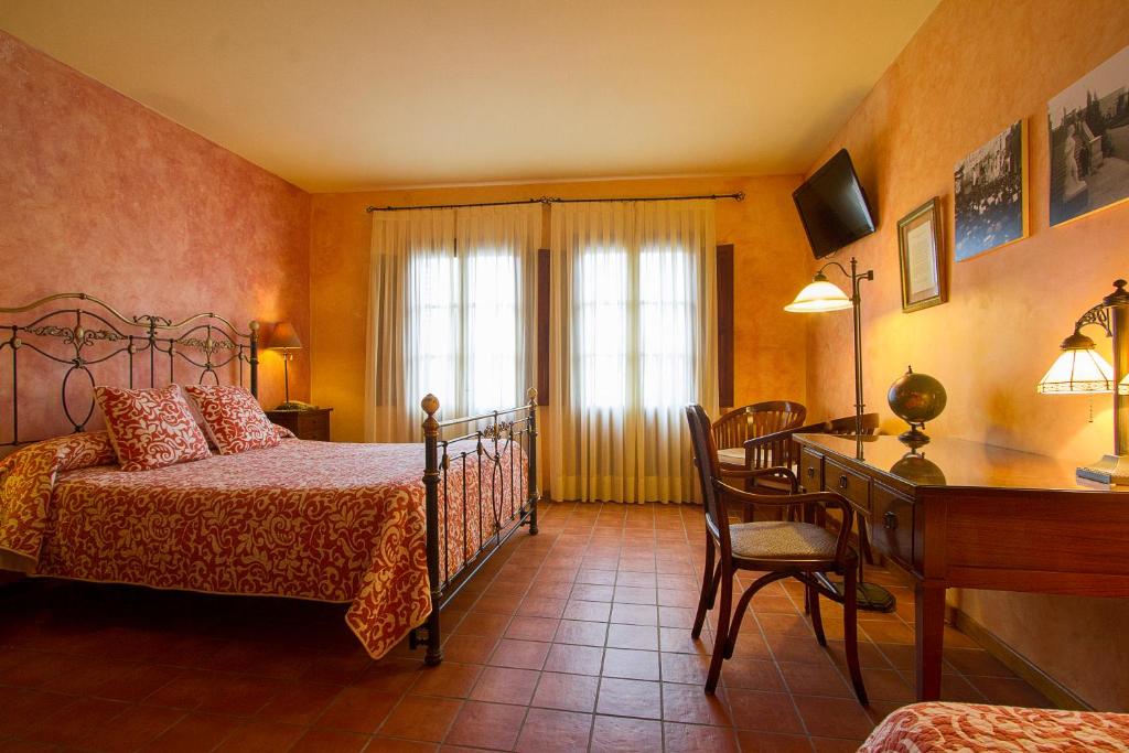 Postel nebo postele na pokoji v ubytování Hotel Antiga