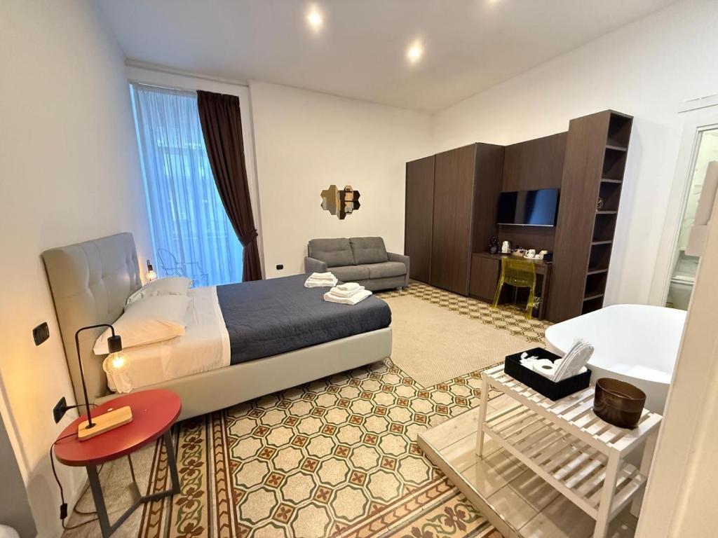 Postel nebo postele na pokoji v ubytování La Piazza Suite
