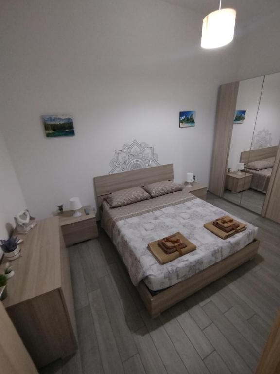 Postel nebo postele na pokoji v ubytování CAMARDA HOME