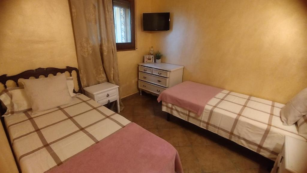 Postel nebo postele na pokoji v ubytování L´ARBOÇ