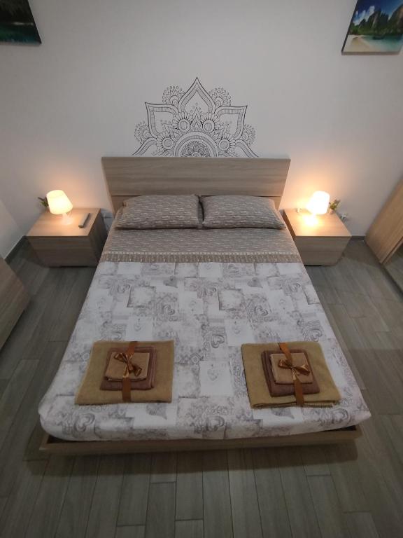 Postel nebo postele na pokoji v ubytování CAMARDA HOME