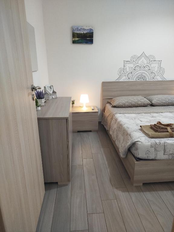 Postel nebo postele na pokoji v ubytování CAMARDA HOME