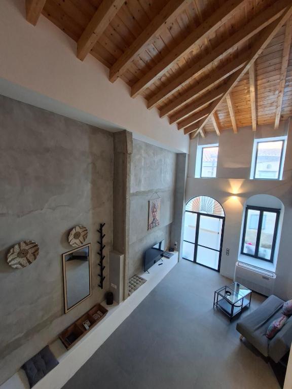 a living room with a couch and a fireplace at Beautiful Plomari Cottage in Plomari