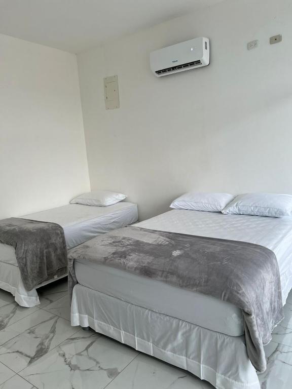 Postel nebo postele na pokoji v ubytování Moderna VIP Vereda Real