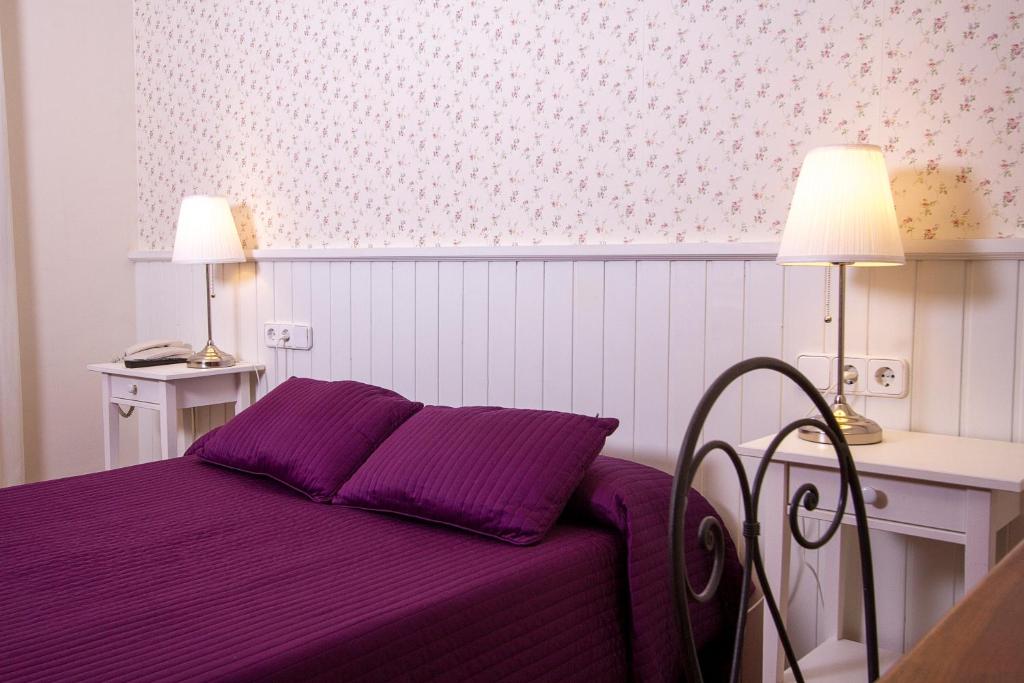 Postel nebo postele na pokoji v ubytování Hotel Antiga