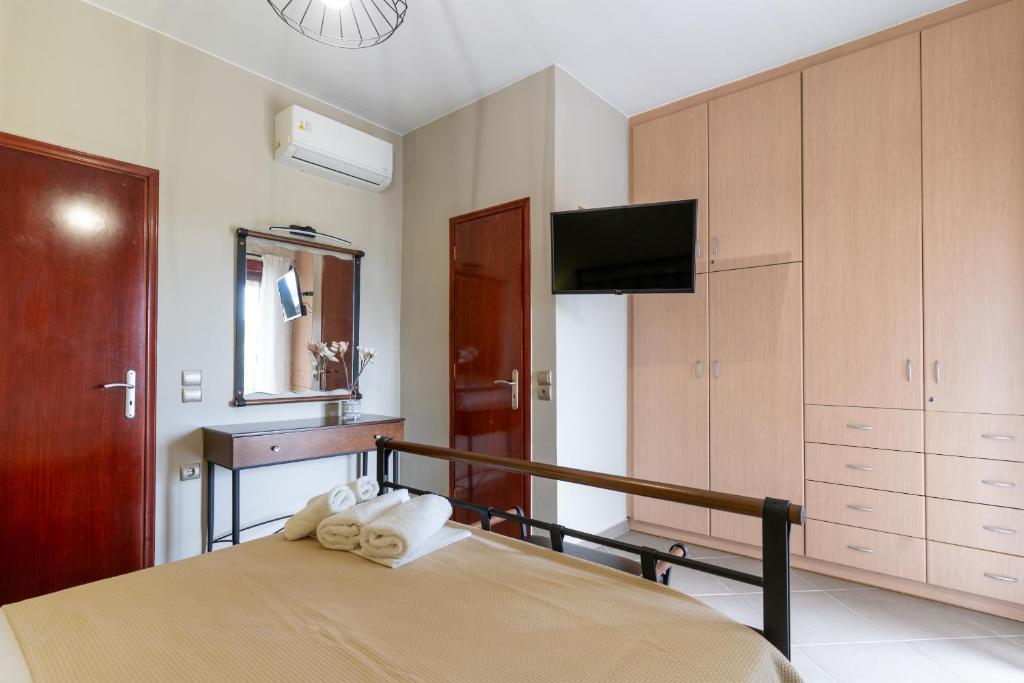 Postel nebo postele na pokoji v ubytování Idothea Stone Villa