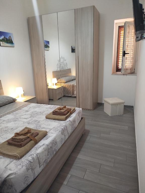Postel nebo postele na pokoji v ubytování CAMARDA HOME