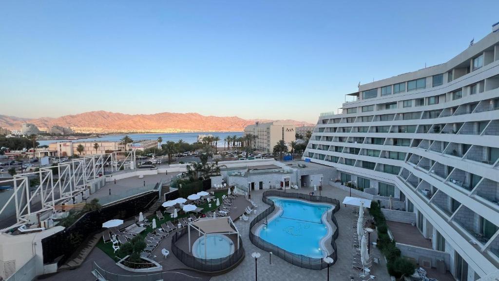 arial view of a hotel with a swimming pool at רויאל שנגרילה in Eilat