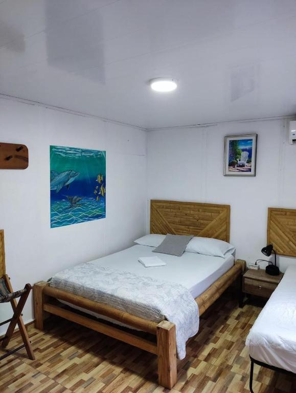 Postel nebo postele na pokoji v ubytování Posada San Nicolas