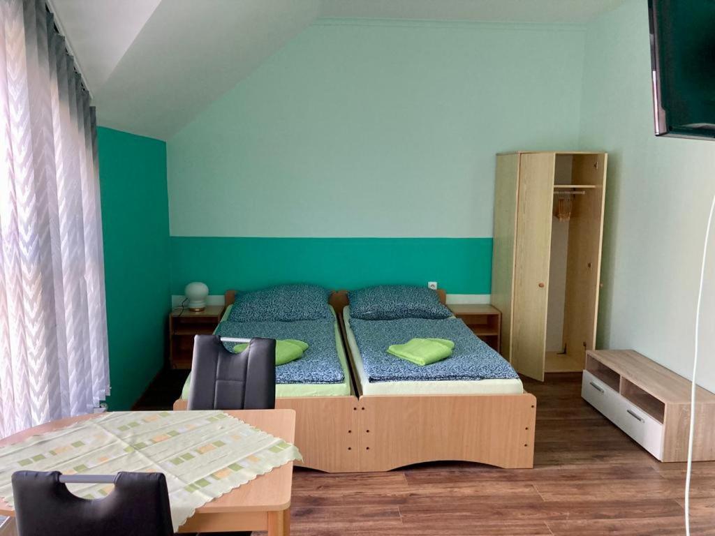 Postel nebo postele na pokoji v ubytování Penzion Hawran