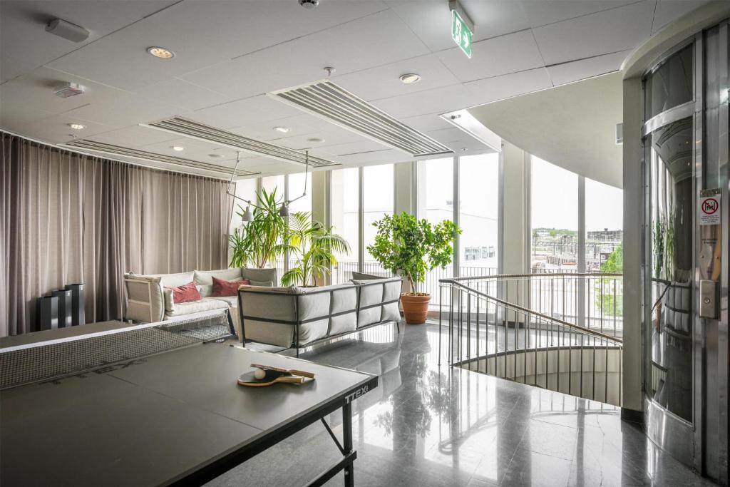 a living room with a couch and a table at Best Western Plus Sthlm Bromma in Stockholm