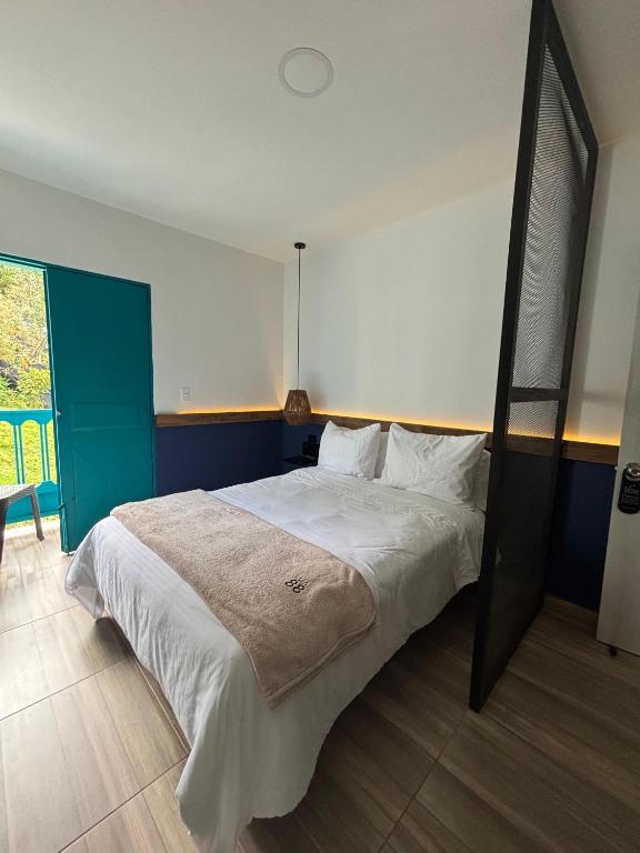 Postel nebo postele na pokoji v ubytování HotelTumbaga88