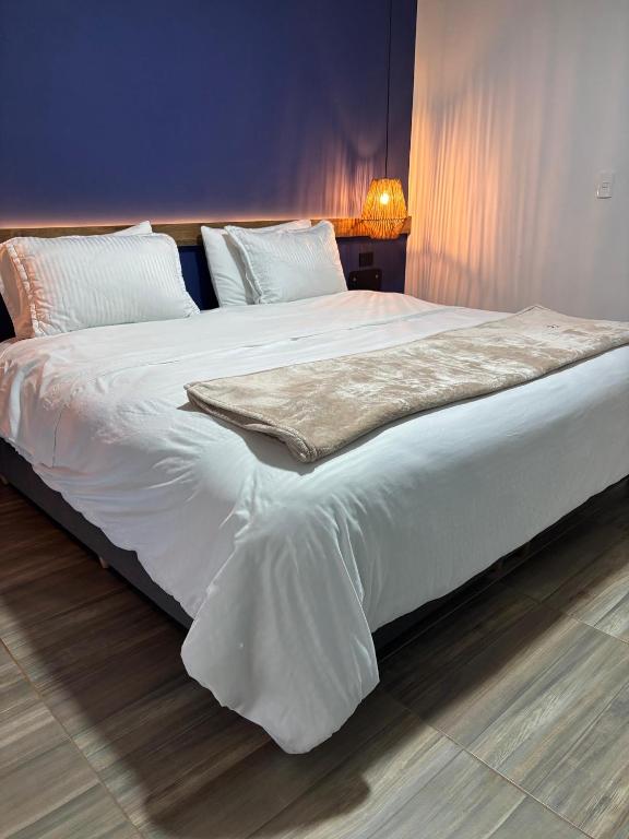 Postel nebo postele na pokoji v ubytování HotelTumbaga88