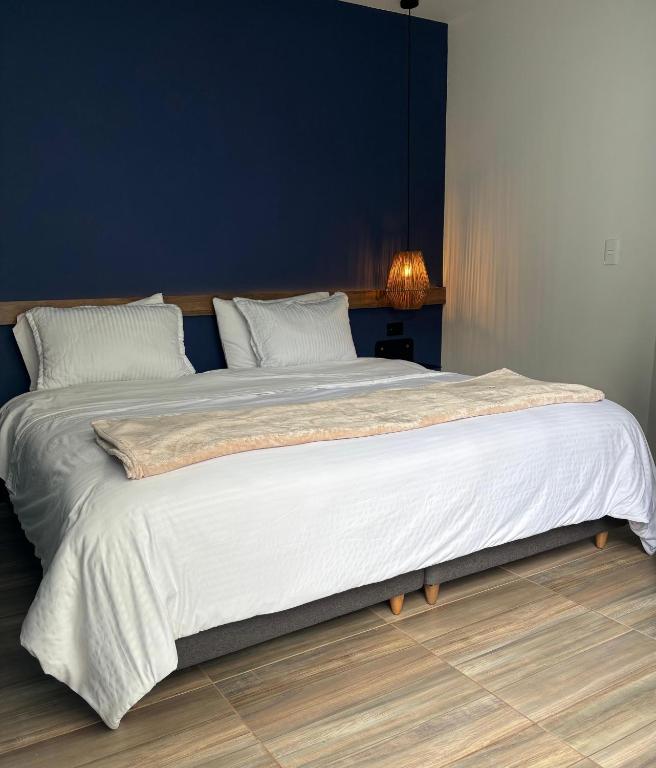 Postel nebo postele na pokoji v ubytování HotelTumbaga88