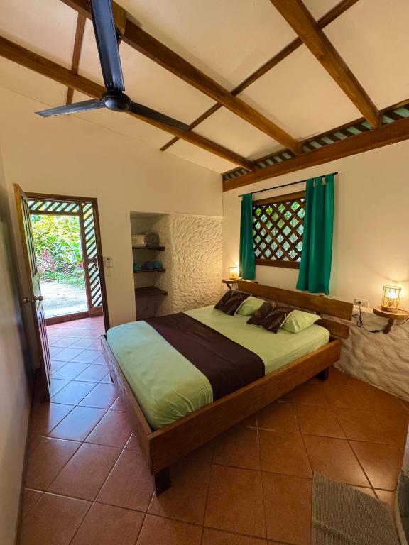 Postel nebo postele na pokoji v ubytování Passion Fruit Lodge