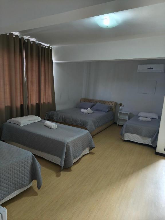 Postel nebo postele na pokoji v ubytování Hotel Colonial