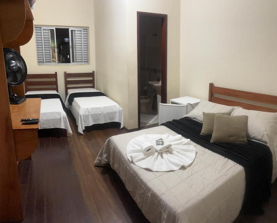 Postel nebo postele na pokoji v ubytování Hotel Chão Mineiro