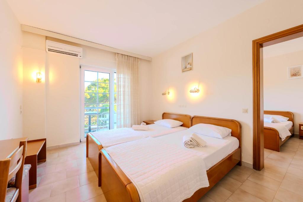 A bed or beds in a room at Artemis