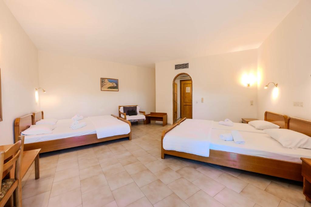 A bed or beds in a room at Artemis