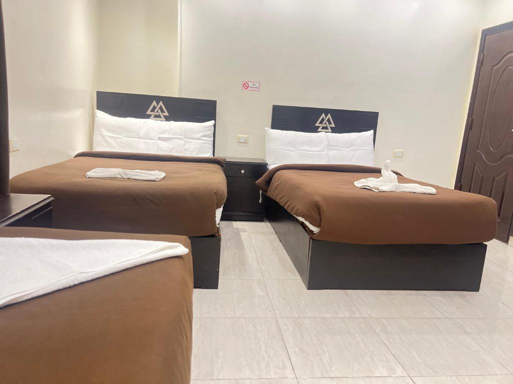 Postel nebo postele na pokoji v ubytování Pyramids Magic View hotel