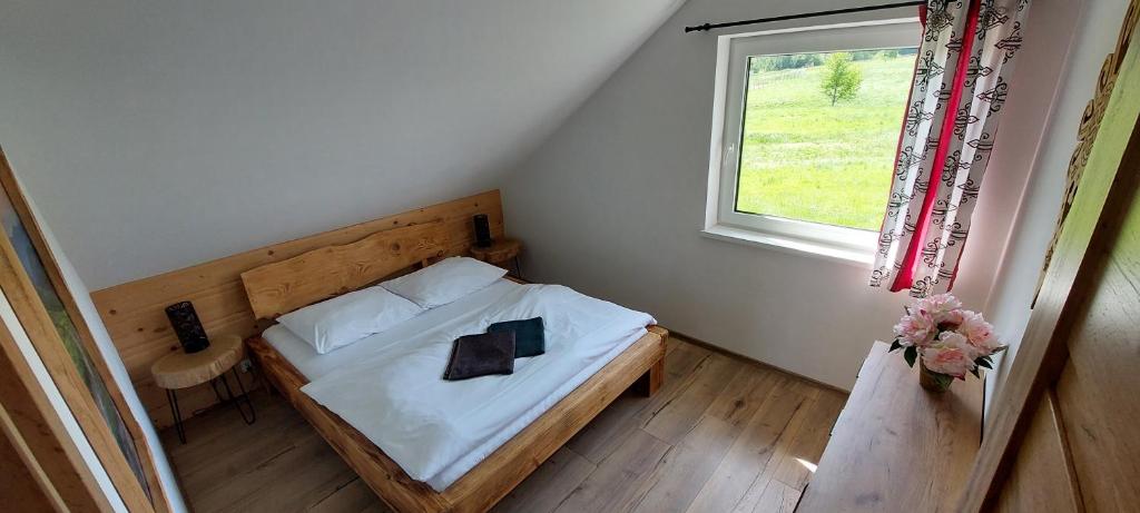 Postel nebo postele na pokoji v ubytování Rajderówka
