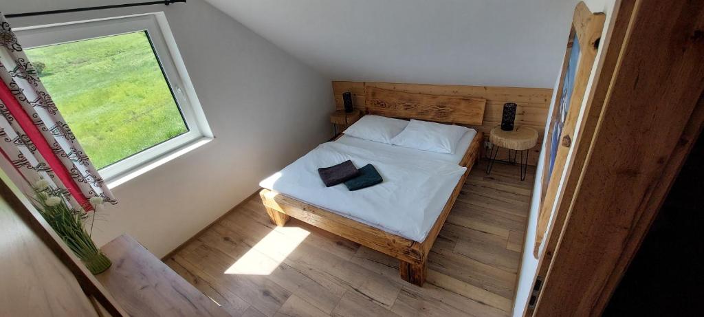 Postel nebo postele na pokoji v ubytování Rajderówka