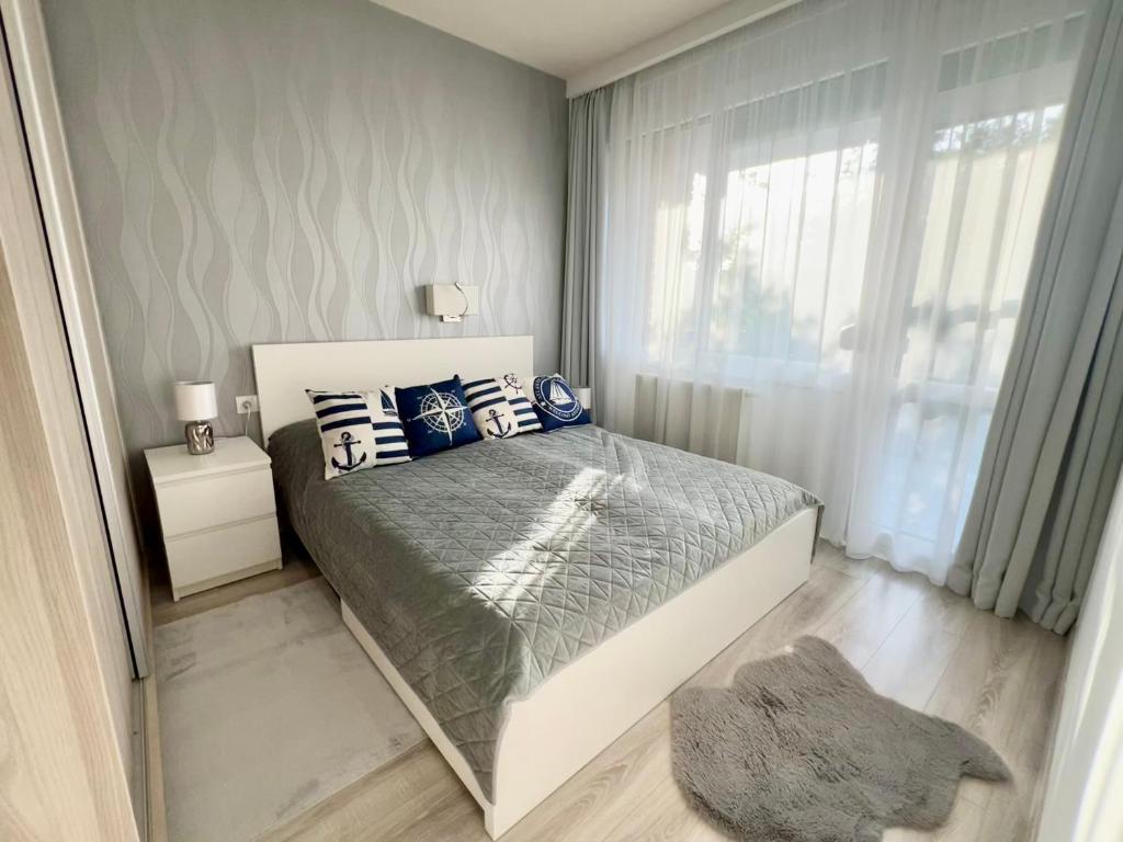 Postel nebo postele na pokoji v ubytování Downtown Dream Apartmans