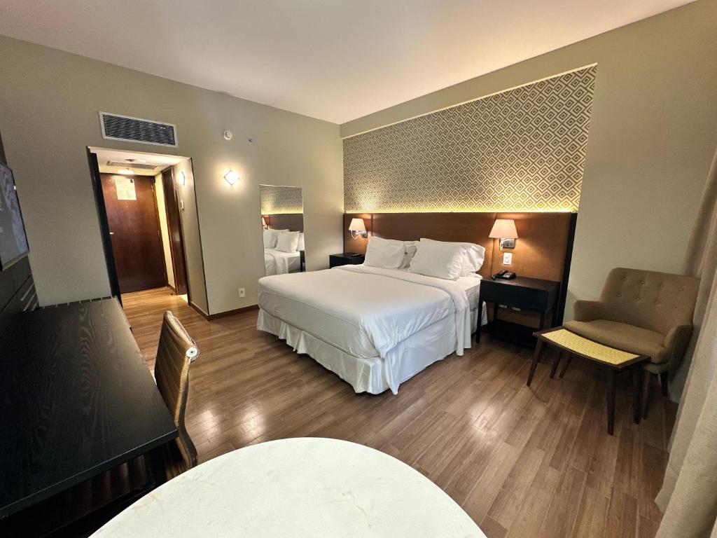 Postel nebo postele na pokoji v ubytování Wish Hotel da Bahia