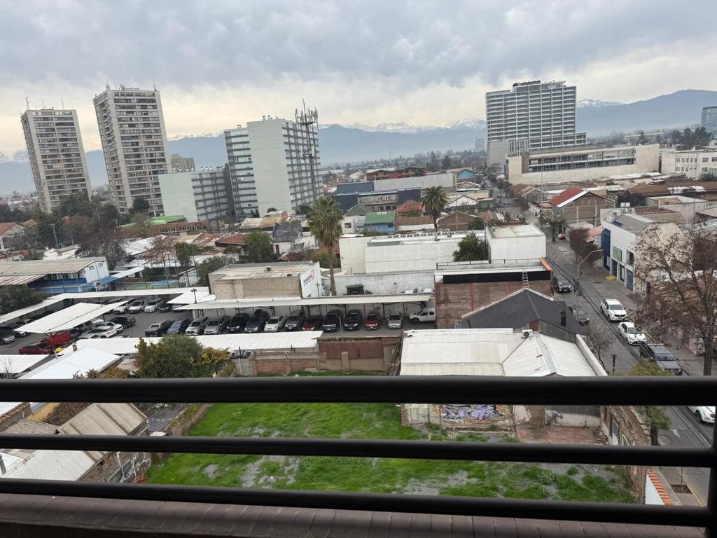 a view of a city from a balcony with buildings at Hermoso Depto Central in Rancagua