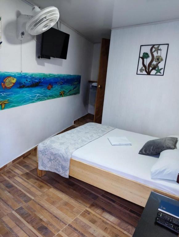 Postel nebo postele na pokoji v ubytování Posada San Nicolas