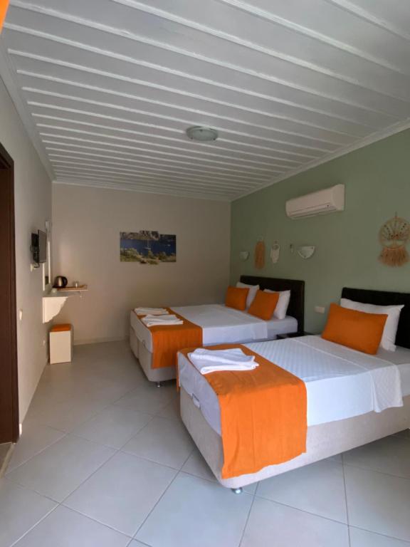 Postel nebo postele na pokoji v ubytování Suna House