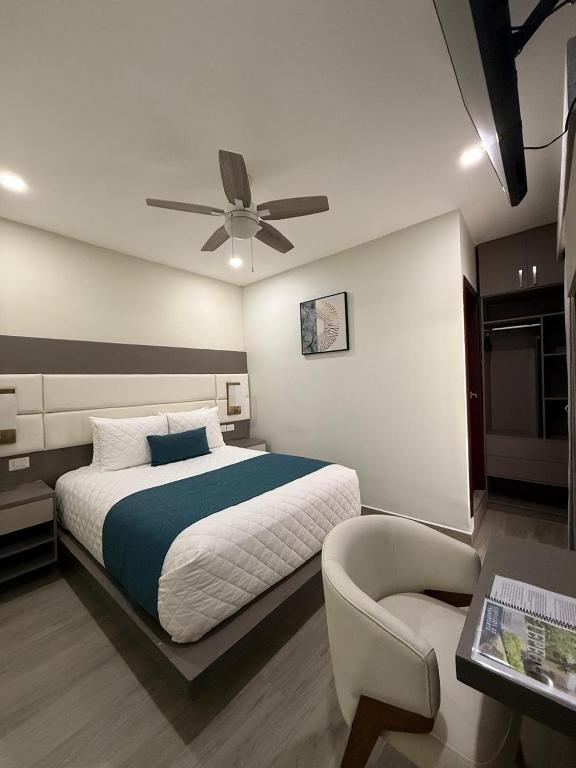Postel nebo postele na pokoji v ubytování Hotel Tepeu