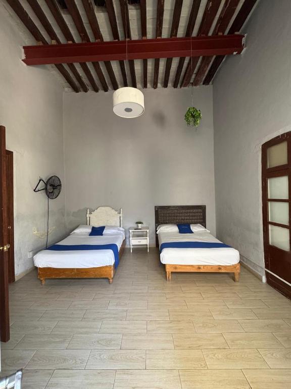 Postel nebo postele na pokoji v ubytování Hotel Queretaro