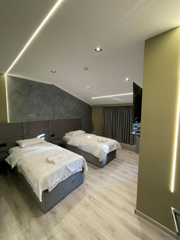 Postel nebo postele na pokoji v ubytování Hotel Dion Kukes