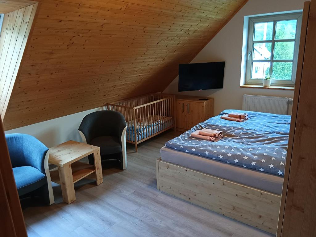 Postel nebo postele na pokoji v ubytování Chalupa Rébus