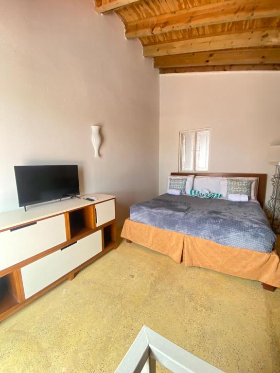 Postel nebo postele na pokoji v ubytování Arco Iris Casa de Campo