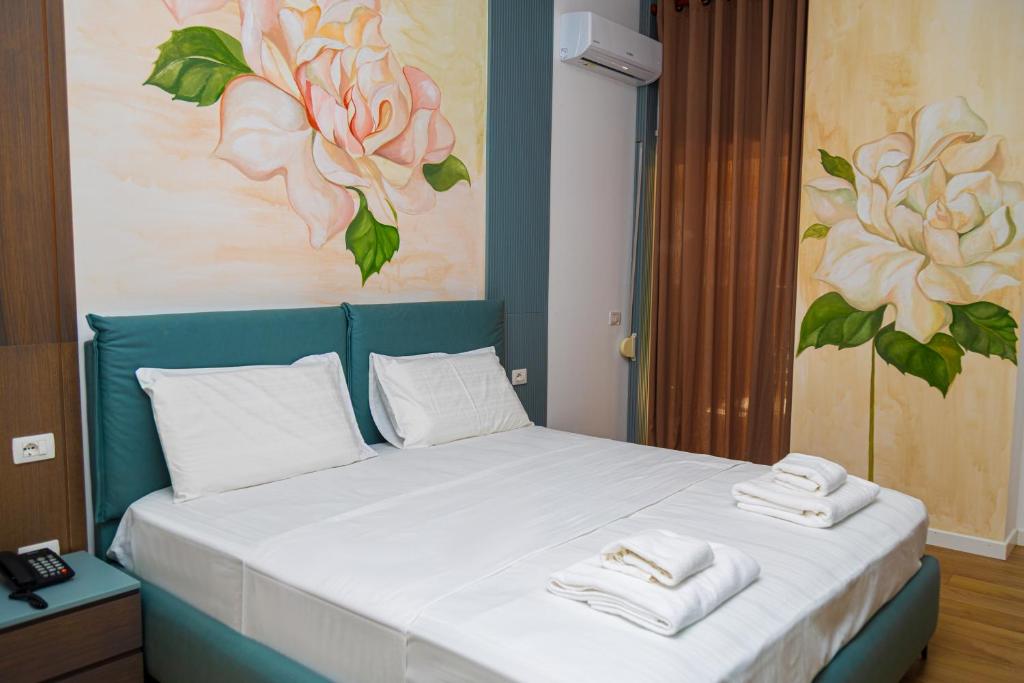 Postel nebo postele na pokoji v ubytování Solis Giselle Hotel