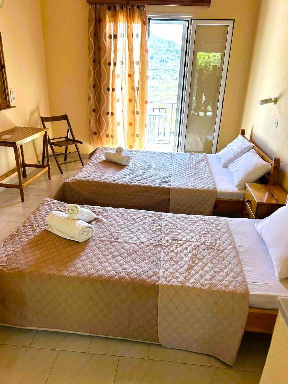 Postel nebo postele na pokoji v ubytování Peyko Rooms