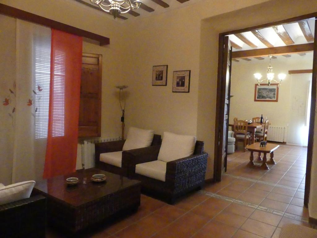a living room with a couch and a table at Casa MI LUCÍA in Moratalla